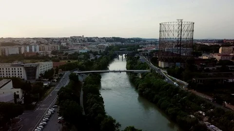 Aerial view, Rome at sunset, River, bridges and the Gasometer in an old district Stock Footage 90646963