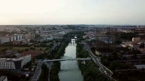 Aerial view, Rome at sunset, River, bridges and the Gasometer in an old district Stock Footage 90659588