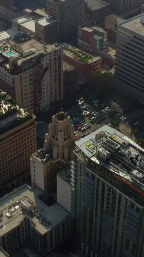 AERIAL: View on Roof Construction Side in Downtown Los Angeles, Daylight Stock Footage 337411665