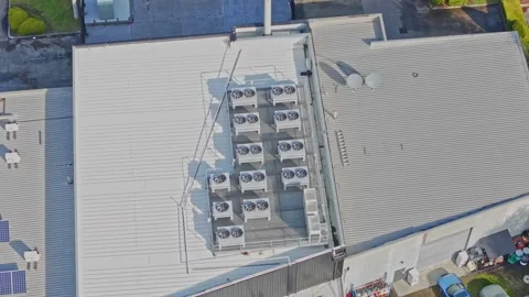 Aerial view of rooftop hvac units operating Stock Footage 340594404