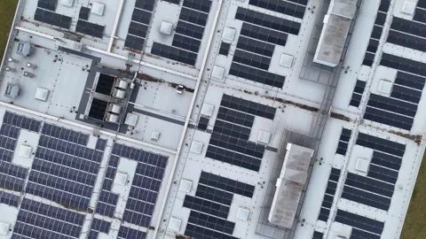 Aerial View of Rooftop Solar Panel Installation on Industrial Building Video stock 328030175