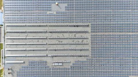 Aerial View of Rooftop Solar Panel Array Stock Photos