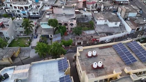 Aerial view of rooftop solar panels on residential homes in India. Видео 335988838
