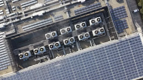 Aerial view of rooftop solar panels and air conditioning units Video stock 339304190
