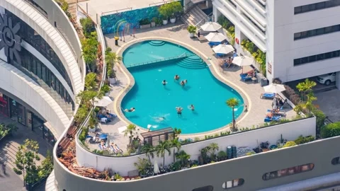 Aerial view of a rooftop swimming pool in Bangkok, Thailand. Timelapse. Stock Footage 345070906