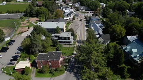 Aerial View of Rooftops Along a Small Quebec Town Street Vídeos de archivo 338325235