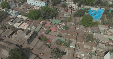 Aerial view of rooftops and streets surrounded by trees, Bangladesh. Stock Footage 303973896
