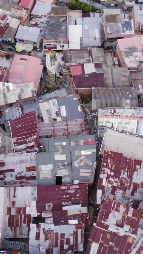 Aerial View of Rooftops of Comuna 13 In Medellin Displaying Varied Surfaces and 動画素材 313893735