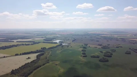 Aerial view rotating 360 degrees above the road in the middle of a large numb Stock Footage 95485409