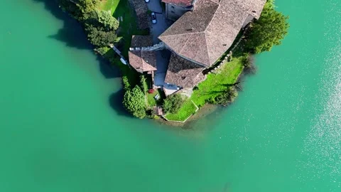 Aerial view rotating around a medieval castle on a lake 스톡 동영상 284982591