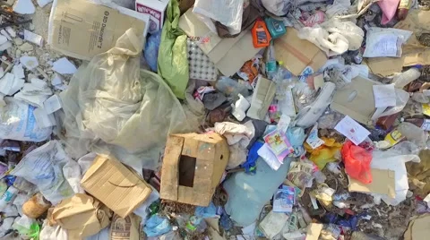 AERIAL VIEW. Rotating the camera rises above the garbage dump Stock Footage 52687023
