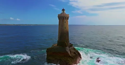 Aerial view. A rotating flight above Phare du Four a lighthouse in Brittany Stock Footage 304711706