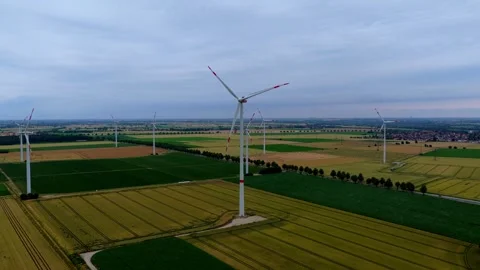 Aerial View of Rotating Wind Turbines Above Rural Farmland Stock Footage 340137296