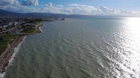 Aerial view of rough ocean under cloudy sky with powerful coastal waves Stock Footage 337463167