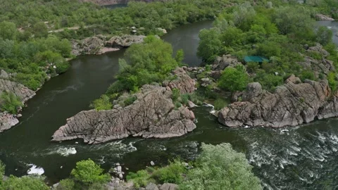 Aerial view of a rough river among the rocks. Mountain river running through a Stock Footage 149212356