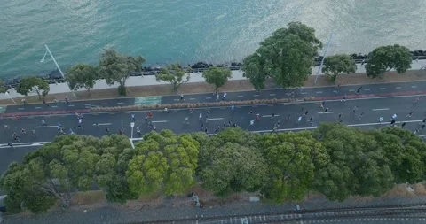 Aerial view of Round the bays fun run along a coastal road in Auckland, New Stock-Footage 303445210