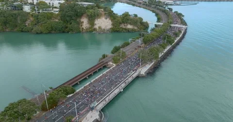 Aerial view of Round the bays fun run along a coastal road in Auckland, New Stock-Footage 303446535
