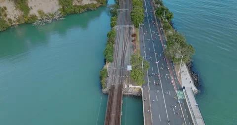 Aerial view of Round the bays fun run along a coastal road in Auckland, New Stock-Footage 303447169