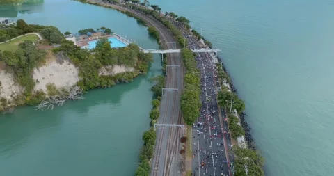 Aerial view of Round the bays fun run along a coastal road in Auckland, New Stock-Footage 303447558