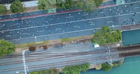 Aerial view of Round the bays fun run along a coastal road in Auckland, New Stock-Footage 303447773