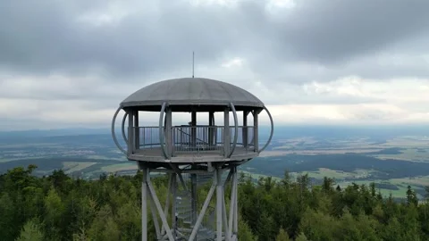 Aerial view of a round observation tower in the mountains, showcasing the view Stock Footage 319532206