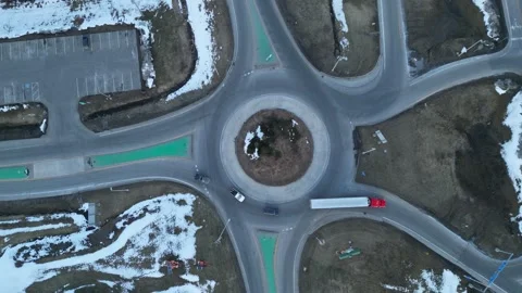 Aerial view on a roundabout road junction with traffic on it Stock-Footage 244510899