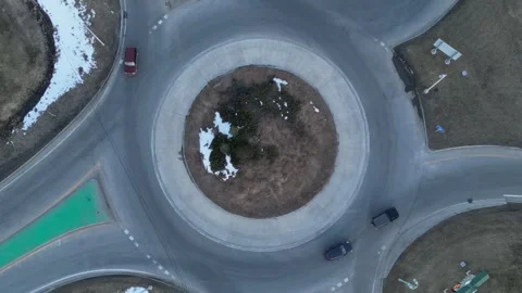 Aerial view on a roundabout road junction with traffic on it Stock Footage 244511029