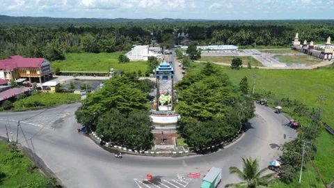 Aerial view of a roundabout with a unique diamond shaped or ketupat buildin.. Stock Footage 276942493