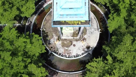 Aerial view of a roundabout with a unique diamond shaped or ketupat buildin.. Stock Footage 276942628
