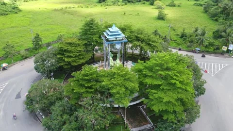Aerial view of a roundabout with a unique diamond shaped or ketupat buildin.. Stock Footage 276943330
