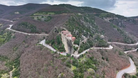 Aerial View of Roussanou Monastery and Winding Mountain Road in Meteora Stock-Footage 344248719
