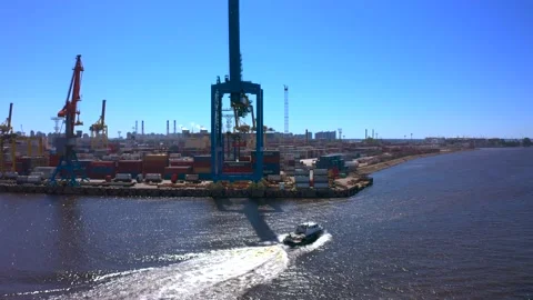 Aerial view of a row of construction or cargo cranes on the river bank 库存影片 136154611