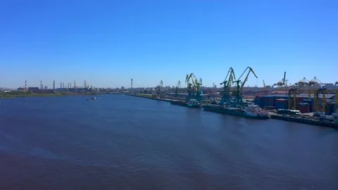 Aerial view of a row of construction or cargo cranes on the river bank 스톡 동영상 136156879