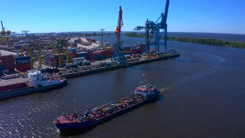 Aerial view of a row of construction or cargo cranes on the river bank Video stock 136167239