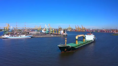Aerial view of a row of construction or cargo cranes on the river bank Stock-Footage 136169837