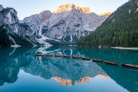 Aerial view of rowing boats lined up on Lago di Braies at sunrise Photos