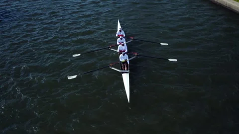 Aerial view of a rowing team training on a river Stock Footage 331687086