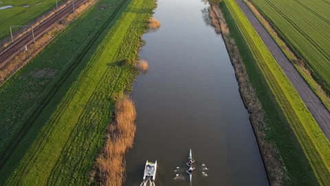 Aerial view of a rowing team training on a canal Stock Footage 336364095