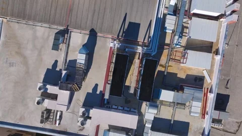 Aerial View: Rows of air conditioning units neatly arranged on the rooftop of a Video stock 296093862