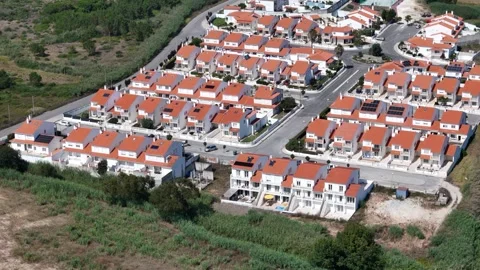 Aerial View of rows of identical suburban Residential Neighborhood Stock Footage 281061002