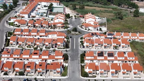Aerial View of rows of identical suburban Residential Neighborhood Stock Footage 281061009