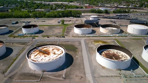 Aerial view of rows of many old fuel storage tanks at oil refinery In Detro.. Stock Footage 318274757