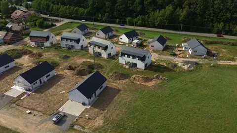 Aerial view of rows of newly build single-family houses in a suburban estate Stock Footage 344982874
