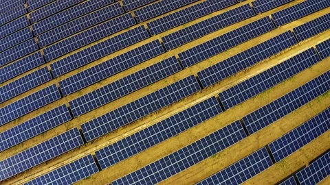 Aerial view of rows of solar panels installed on a vast field Stock Footage 129700455