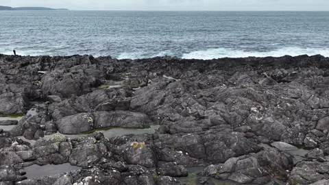 Aerial view of rugged Atlantic shore with crashing waves, Ireland Stock Footage 342734656