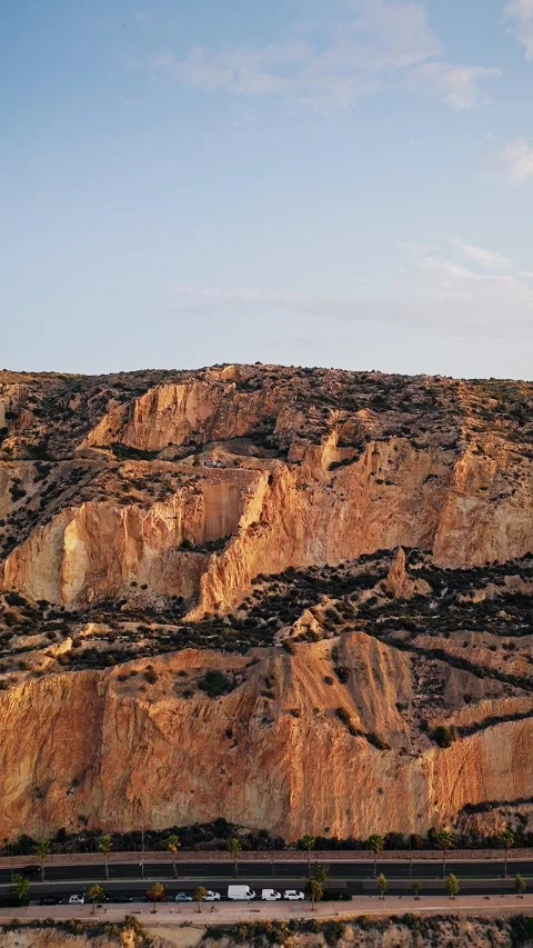 Aerial view of rugged cliffs during golden hour in Spain Stock Footage 312217313