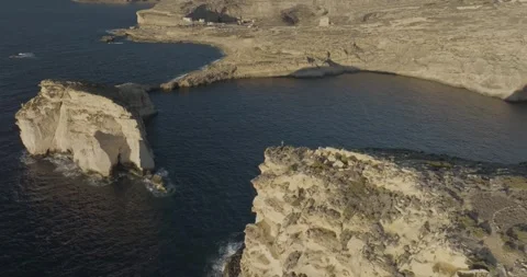 Aerial view of rugged cliffs by the sea, Malta. Stock Footage 275928969