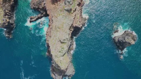 Aerial View of Rugged Coastal Cliffs and Turquoise Ocean Waters. Stock Footage 324506172