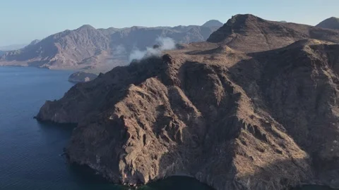 Aerial view of the rugged coastal cliffs of Isla San Jose north of La Paz in Stock Footage 346161236