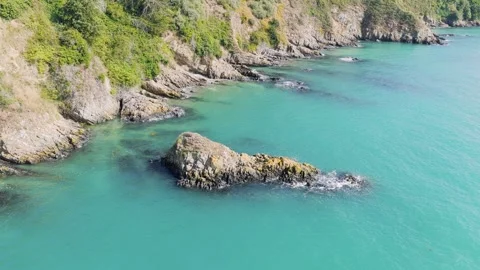Aerial view of rugged coastal cliffs and turquoise waters near Binic, Brittany Stock Footage 346665004